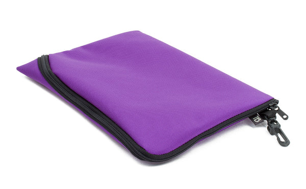 An A5 Ghost Whale Pouch in Alphaviolet (bright purple).